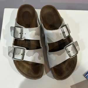 White and gray Birkenstock